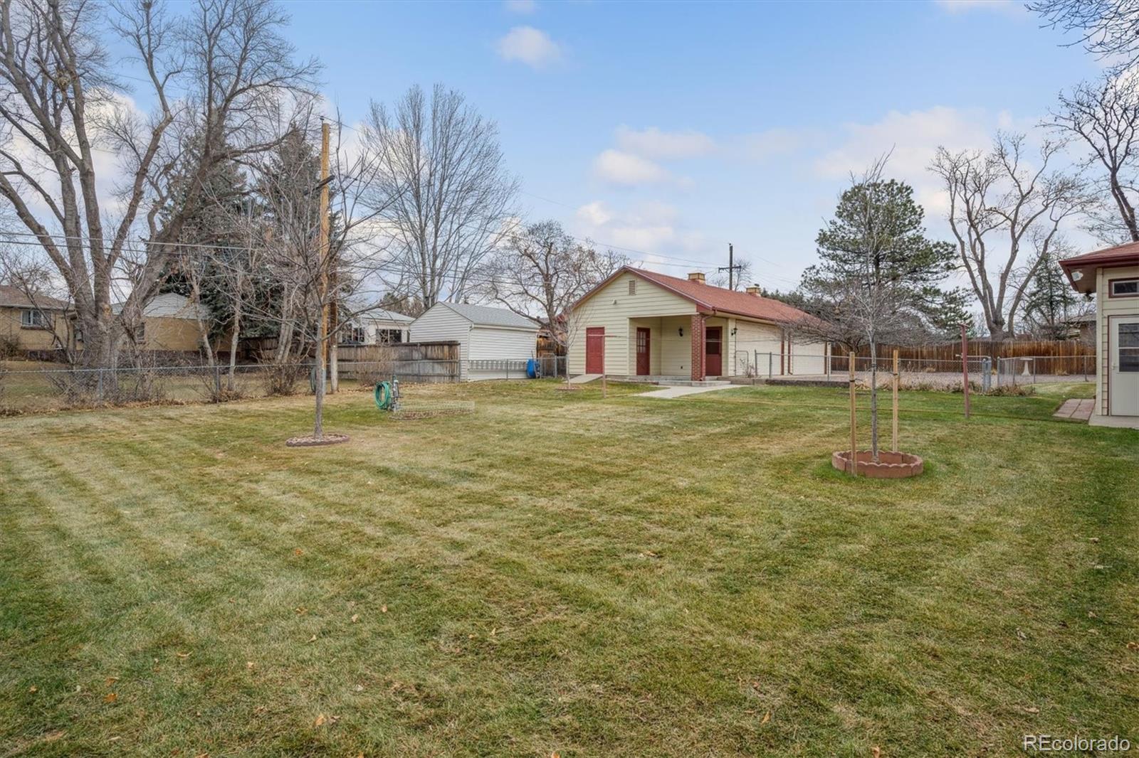 7505 West 47th Avenue Wheat Ridge, CO 80033 - Photo 5 of 35 a view of a house with a yard