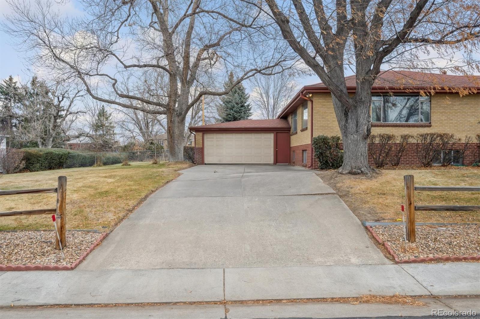 7505 West 47th Avenue Wheat Ridge, CO 80033 - Photo 6 of 35 a view of a house with a yard