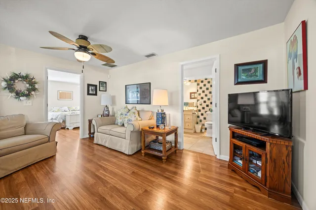 a bedroom with a bed and a large mirror