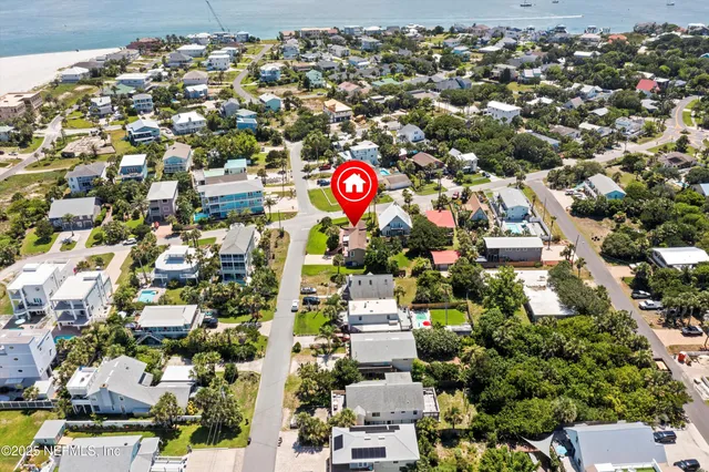 an aerial view of beach and ocean