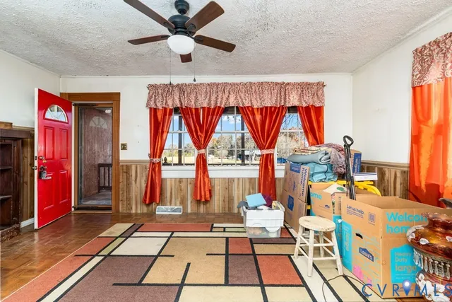 a very nice looking room with a large window and chandelier