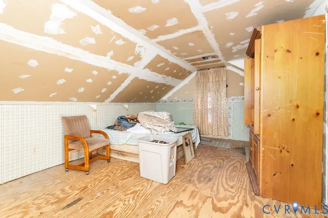 a living room with a sink and furniture