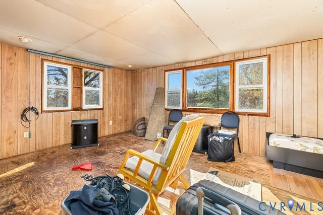 a bedroom with furniture and a fireplace