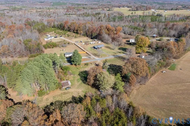 a aerial view of residential house with beach and green space