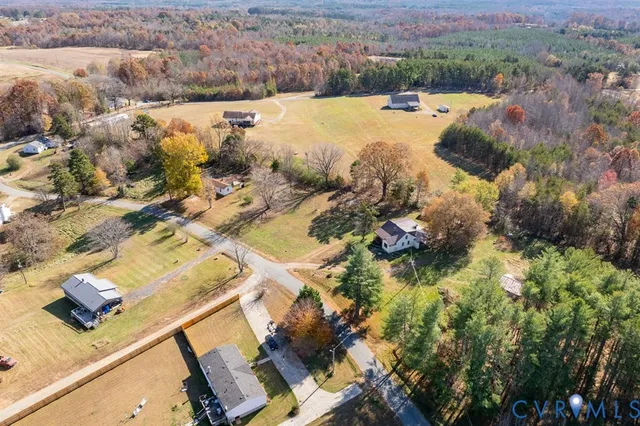a view of lot of houses and yard