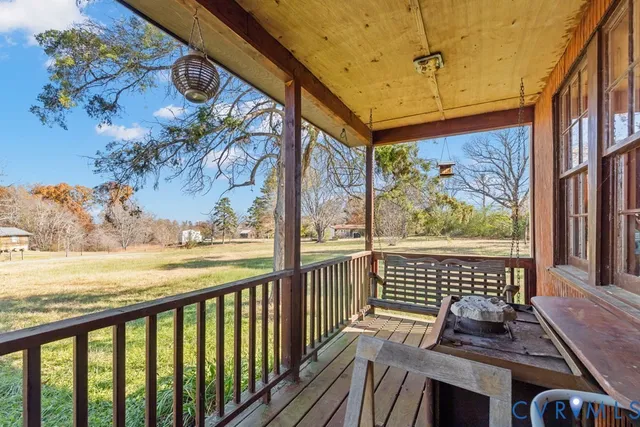 a view of a balcony with furniture