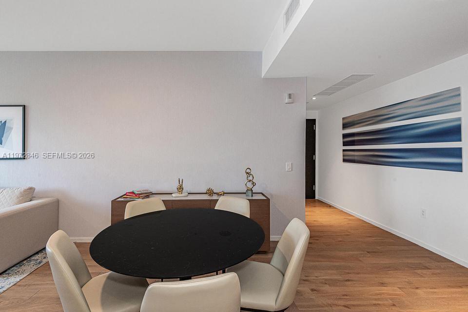 398 Northeast 5th Street, Unit 2418 Miami, FL 33132 - Photo 15 of 34 a living room with furniture and a wooden floor