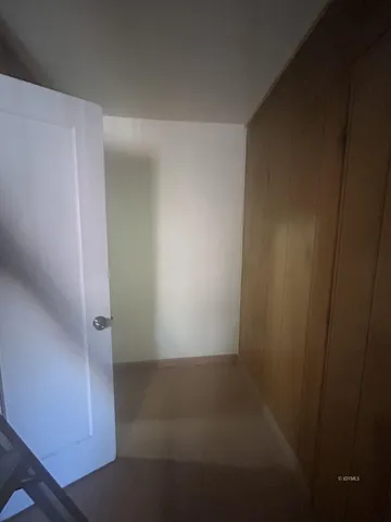 a bathroom with a granite countertop sink a toilet and mirror