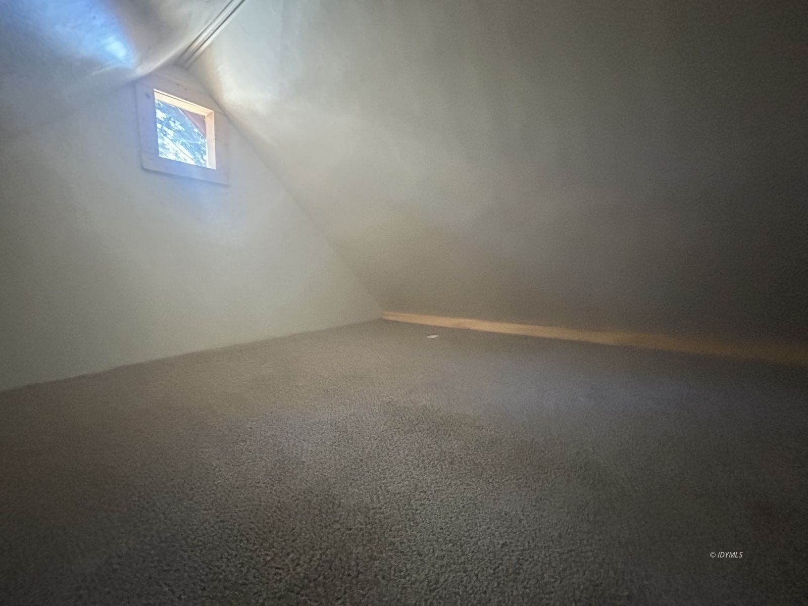 25055 Marion Ridge Drive, Unit 9 Idyllwild, CA 92549 - Photo 10 of 11 a view of an empty room and a window