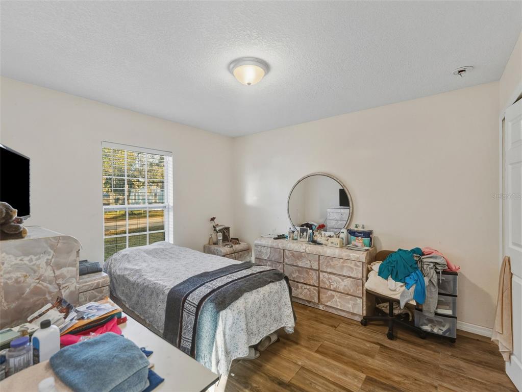 5104 Timberlan Street Tampa, FL 33624 - Photo 17 of 27 a bedroom with a bed and a window