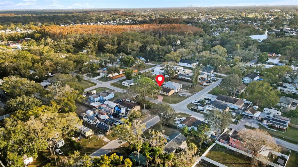 5104 Timberlan Street Tampa, FL 33624 - Photo 26 of 27 an aerial view of a house with a lake view
