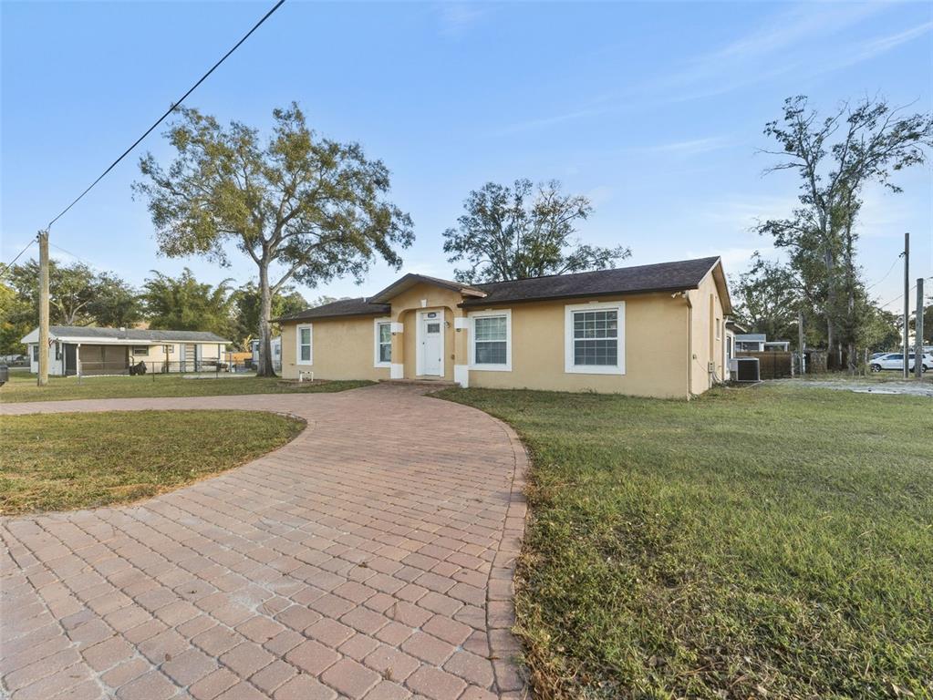 5104 Timberlan Street Tampa, FL 33624 - Photo 3 of 27 a view of a house with a yard