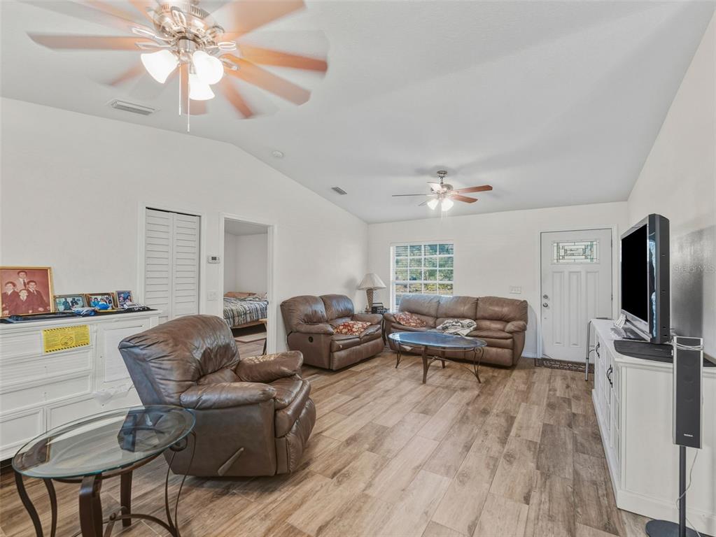 5104 Timberlan Street Tampa, FL 33624 - Photo 6 of 27 a living room with furniture and a flat screen tv