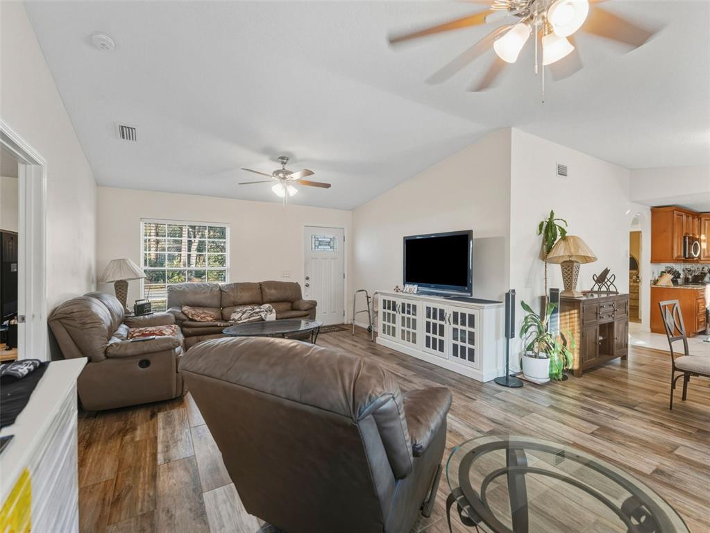 5104 Timberlan Street Tampa, FL 33624 - Photo 7 of 27 a living room with furniture and a flat screen tv