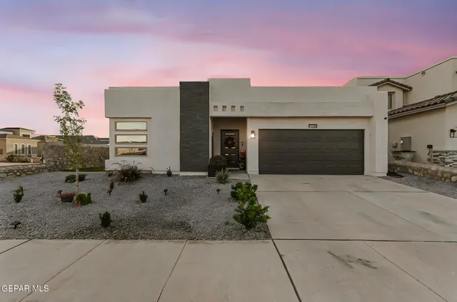 a living room with furniture a flat screen tv and a window