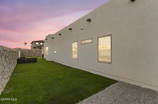 an aerial view of a residential apartment building with a yard