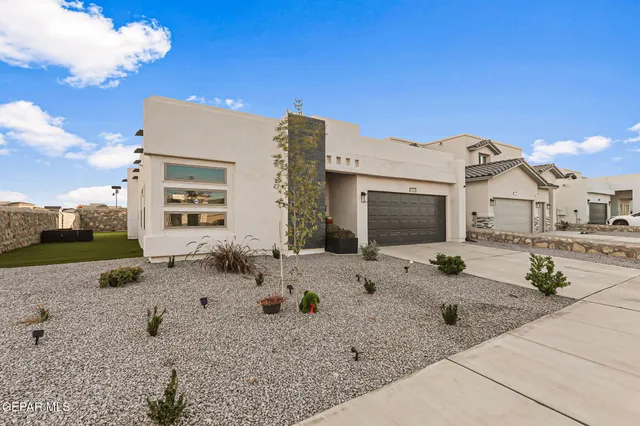 a view of a swimming pool with a table and chairs