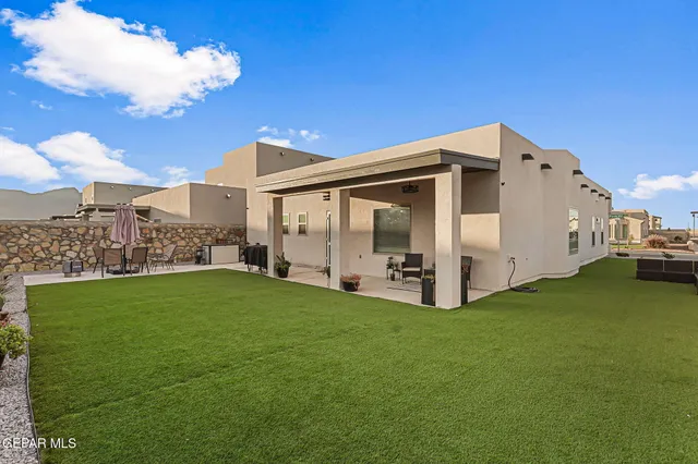 a view of a swimming pool with a lounge chair