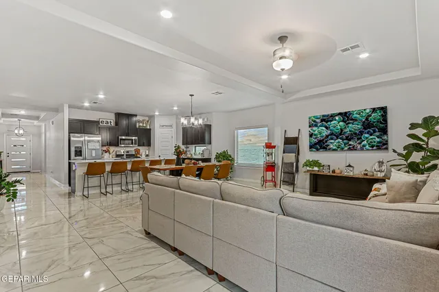 a kitchen with a counter top space a sink stainless steel appliances and cabinets