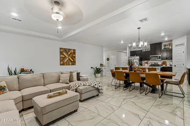 a kitchen with stainless steel appliances granite countertop a stove and a microwave