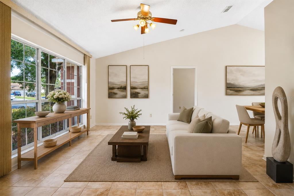 2596 Alclobe Circle Ocoee, FL 34761 - Photo 12 of 70 a living room with furniture and a dining table