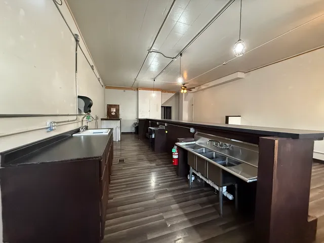 a kitchen with lots of counter top space and stainless steel appliances