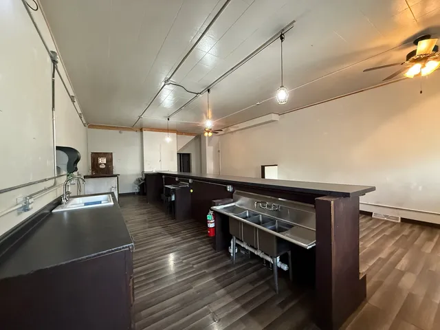 a kitchen with lots of counter space and a sink