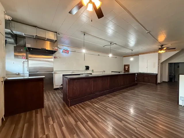 a kitchen with stainless steel appliances wooden cabinets and granite counter tops