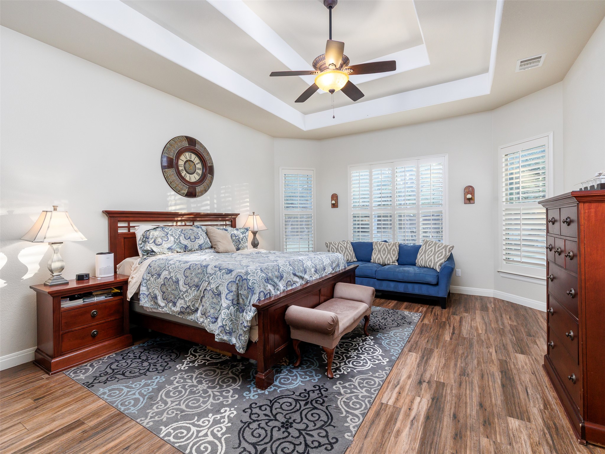 1316 Ranchers Club Lane Driftwood, TX 78619 - Photo 13 of 40 a bedroom with a bed and a chandelier