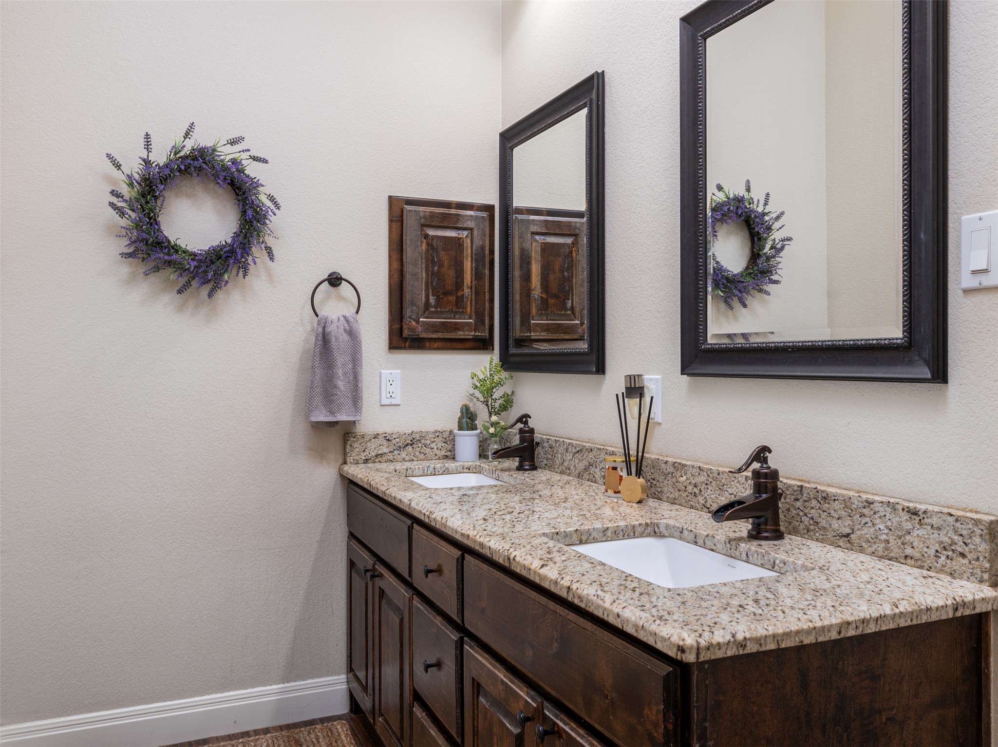 1316 Ranchers Club Lane Driftwood, TX 78619 - Photo 20 of 40 a bathroom with a granite countertop sink and a mirror