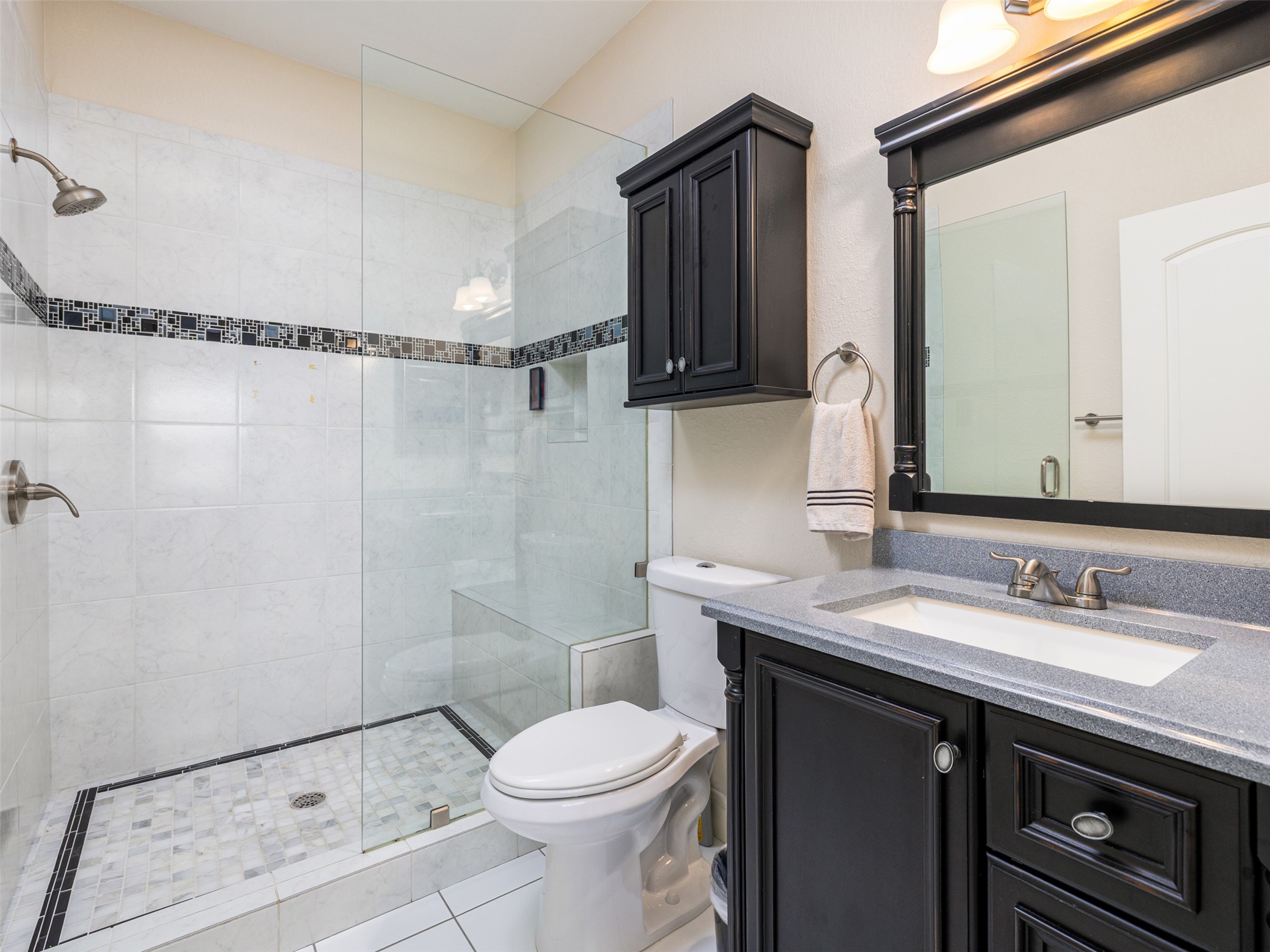 1316 Ranchers Club Lane Driftwood, TX 78619 - Photo 25 of 40 a bathroom with a sink a toilet and shower
