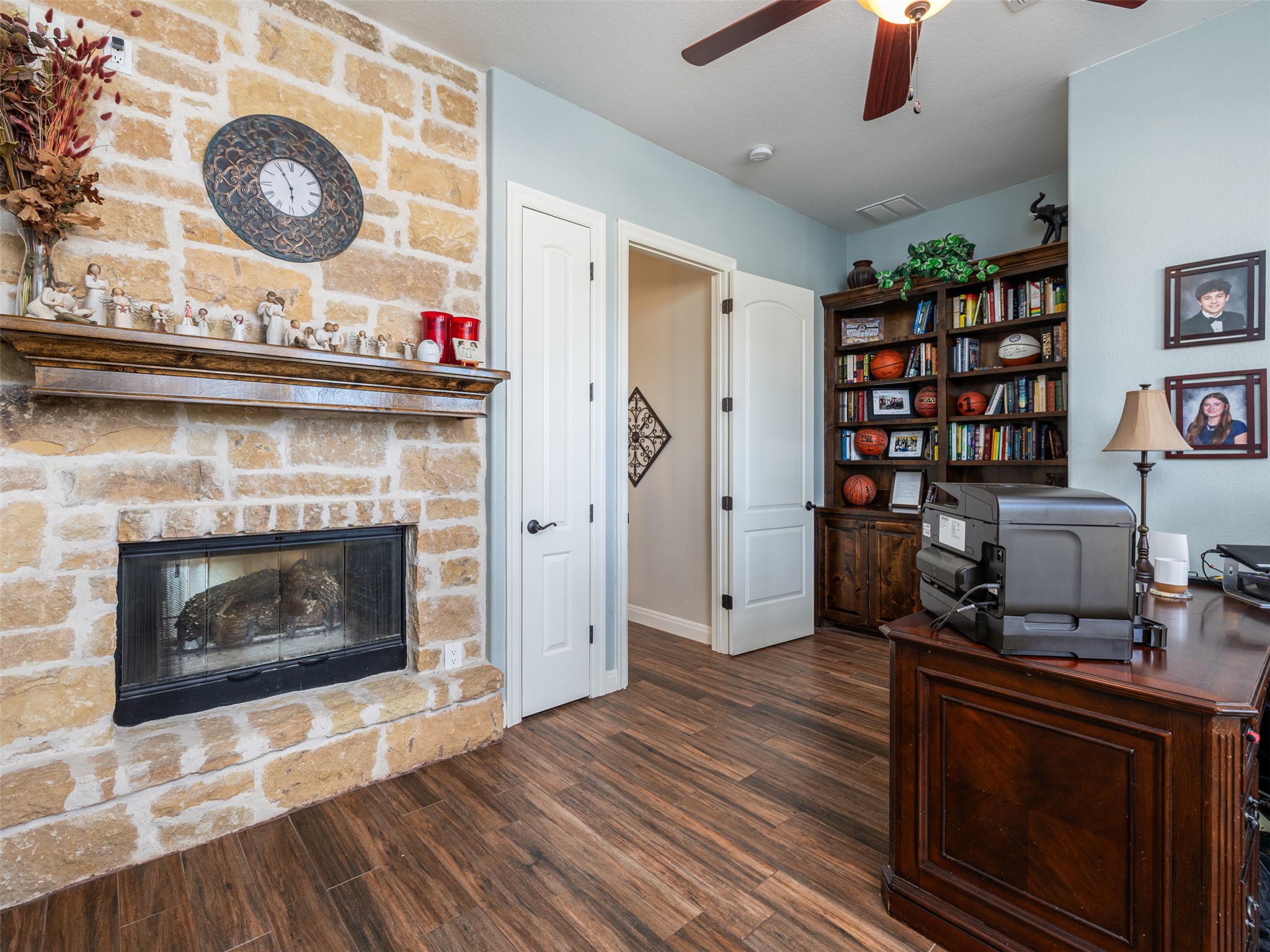 1316 Ranchers Club Lane Driftwood, TX 78619 - Photo 28 of 40 a living room with furniture and a fireplace