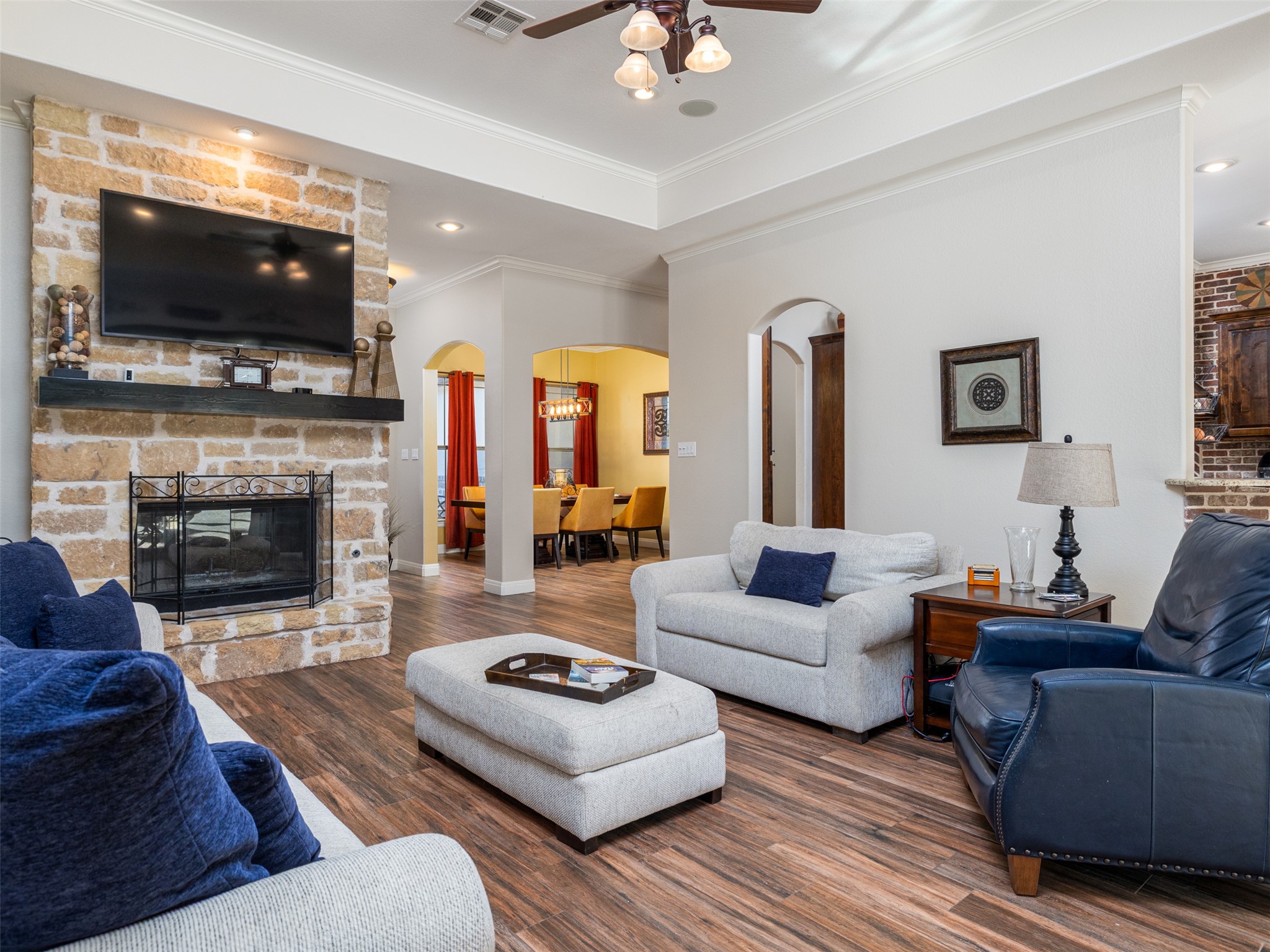 1316 Ranchers Club Lane Driftwood, TX 78619 - Photo 5 of 40 a living room with fireplace furniture and a flat screen tv
