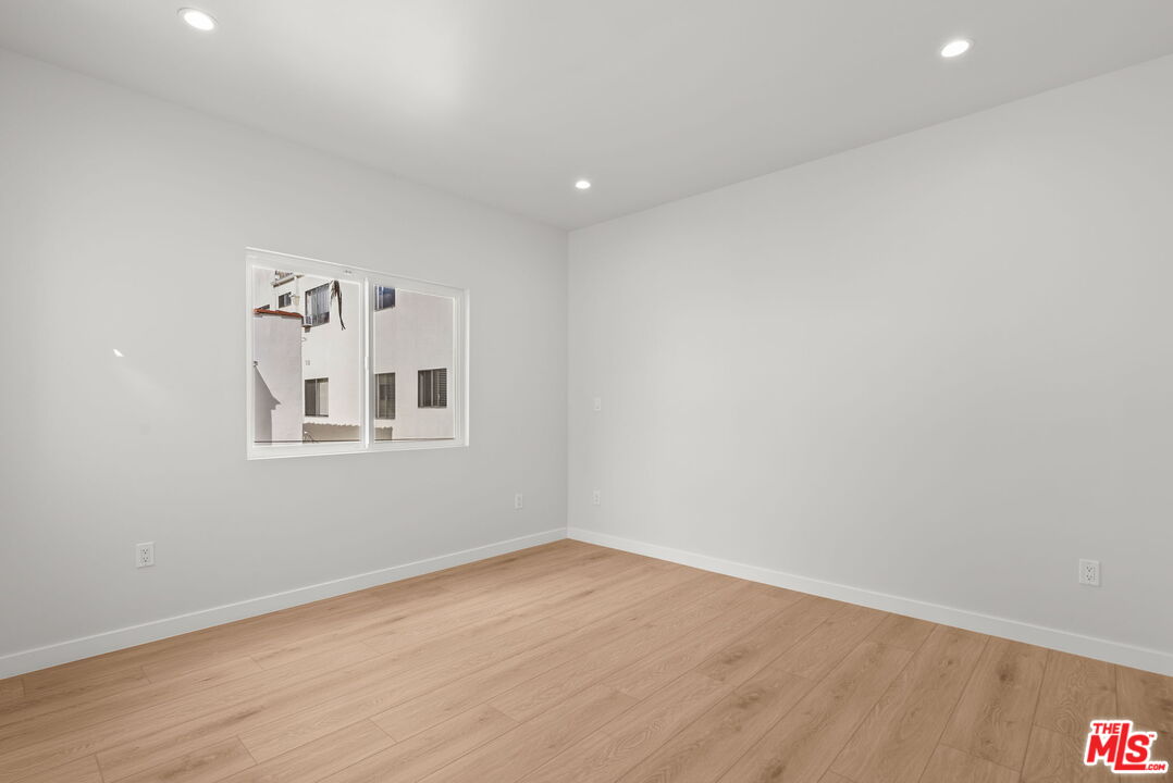 128 South Swall Drive, Unit 1/2 Los Angeles, CA 90048 - Photo 22 of 32 a view of a livingroom with wooden floor and a window