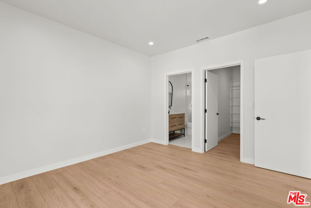 128 South Swall Drive, Unit 1/2 Los Angeles, CA 90048 - Photo 23 of 32 a view of empty room with wooden floor