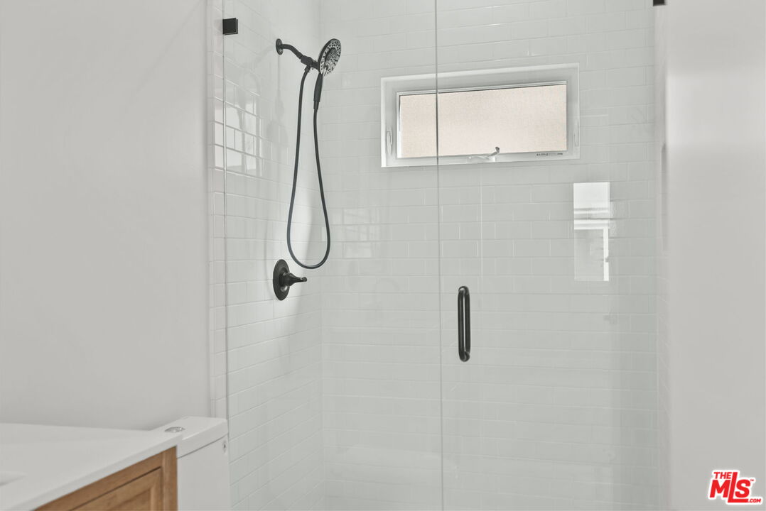 128 South Swall Drive, Unit 1/2 Los Angeles, CA 90048 - Photo 26 of 32 a bathroom with a shower
