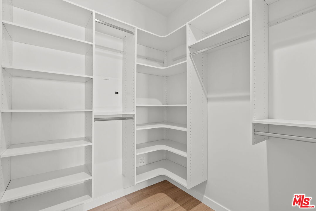 128 South Swall Drive, Unit 1/2 Los Angeles, CA 90048 - Photo 27 of 32 a view of walk in closet with empty racks