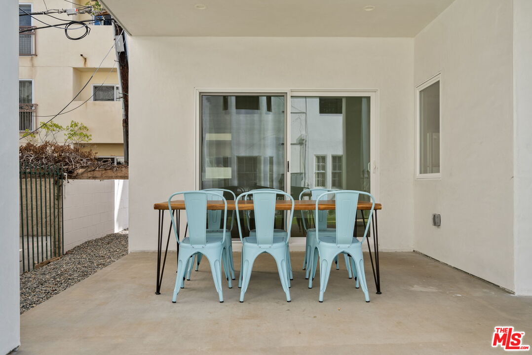 128 South Swall Drive, Unit 1/2 Los Angeles, CA 90048 - Photo 28 of 32 a view of a dining room with furniture and a rug