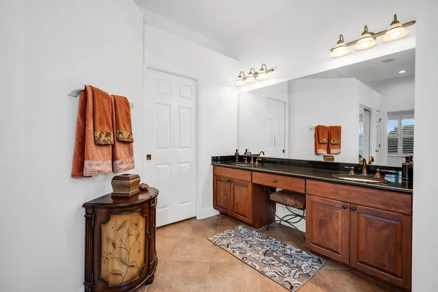a large bathroom with a sink and a mirror