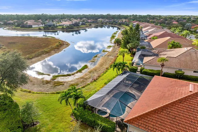 an aerial view of residential houses and outdoor space