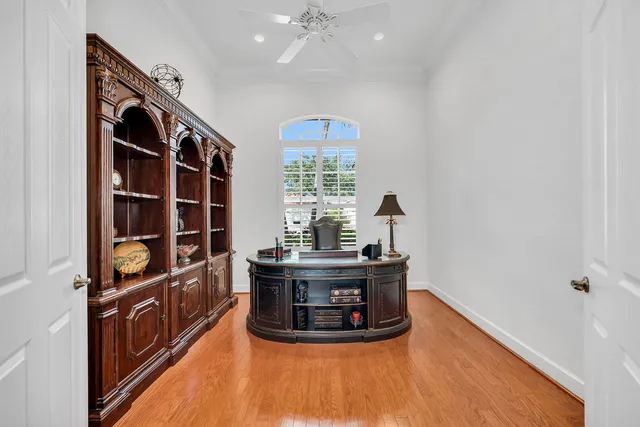 a view of a living room with furniture and a window
