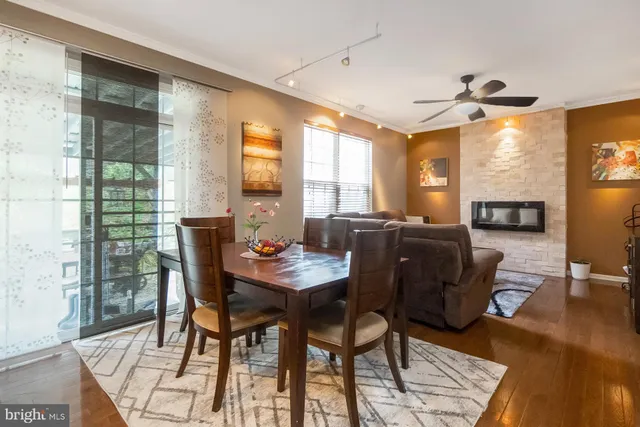 a kitchen with stainless steel appliances granite countertop a refrigerator a stove top oven a sink dishwasher and wooden cabinets