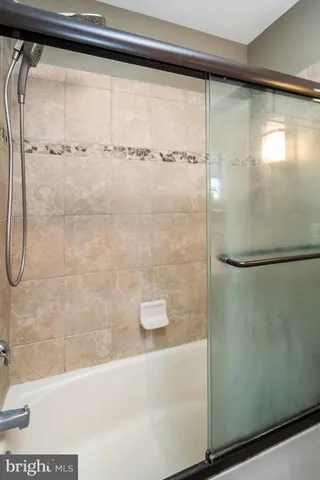 a bathroom with a toilet sink and shower