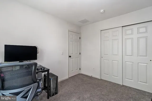 a kitchen with stainless steel appliances kitchen island granite countertop a refrigerator and cabinets