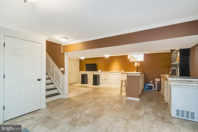 a front view of a house with sitting area