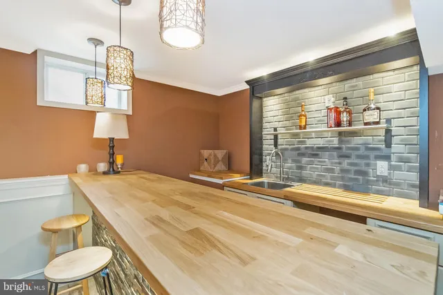 a view of a chair and tables on the roof deck