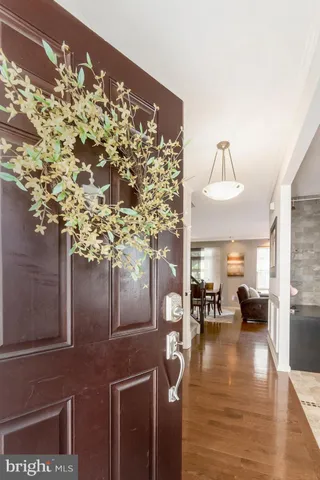 a living room with furniture and a dining table