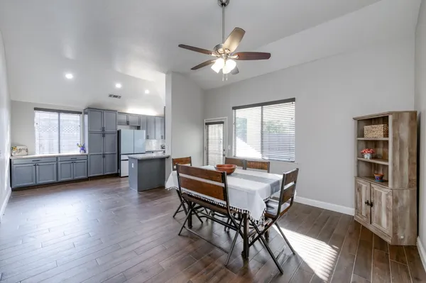 a dining room with furniture and window