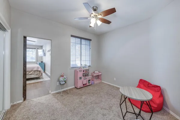 a bedroom with furniture and a window