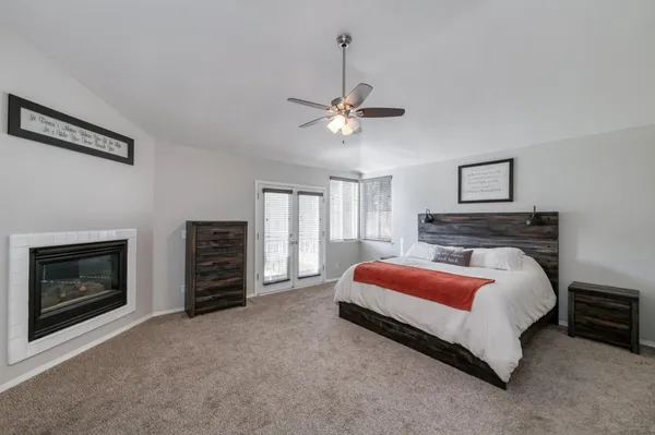 a bed room with a bed and a fireplace